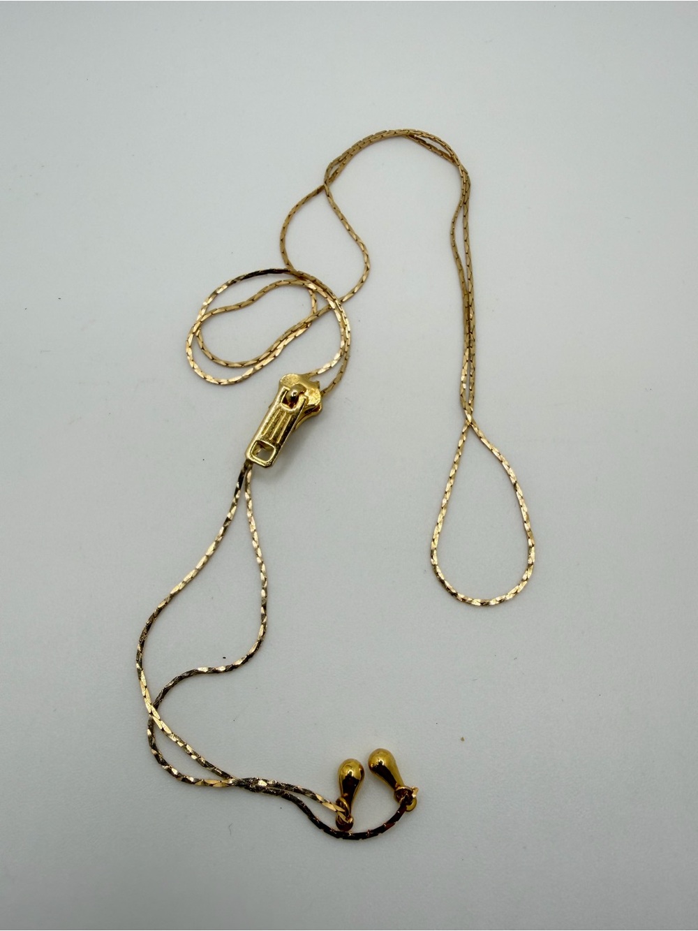 up to 27" gold tone metal "Zipper" bolo necklace!